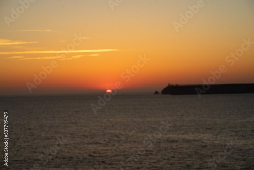 mystical sunset by the sea with a section of coast  © Kaufi