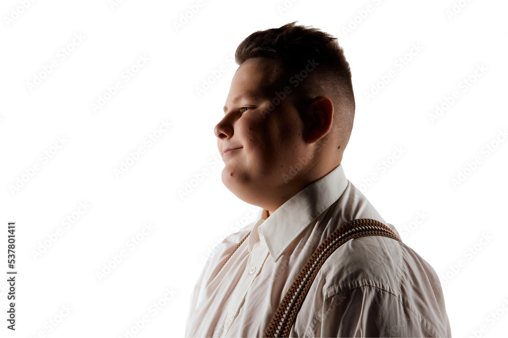 Happy face. Smiling boy, overweight model in white shirt and suspenders isolated over white studio background. Concept of youth, emotions, facial expressions Happy face. Smiling boy, overweight model in white shirt and suspenders isolated over white studio background. Concept of youth, emotions, facial expressions
