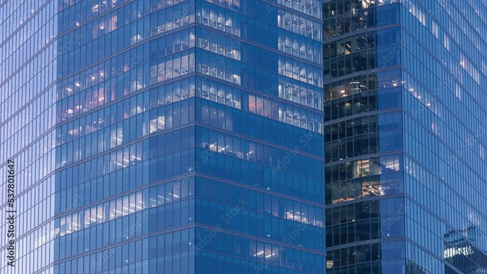 Day to night transition blinking office window lights time-lapse, windows texture grid, skyscraper business center building downtown, glass surface, turn on and off lights, people working in evening Day to night transition blinking office window lights time-lapse, windows texture grid, skyscraper business center building downtown, glass surface, turn on and off lights, people working in evening