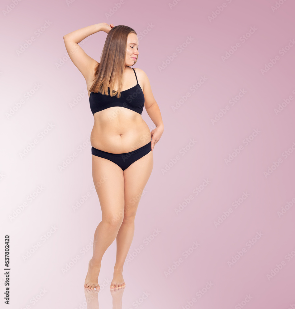 Naklejka premium Confident woman with overweight natural body posing.