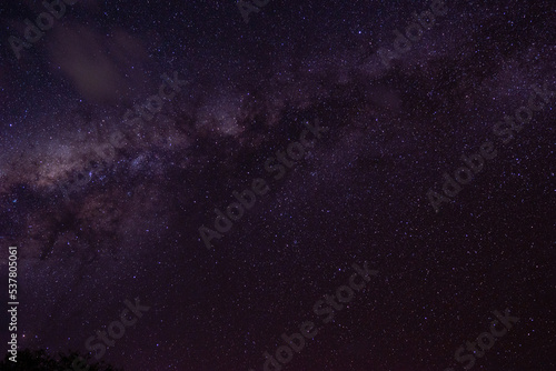 night photo with milky way in the starry purple sky