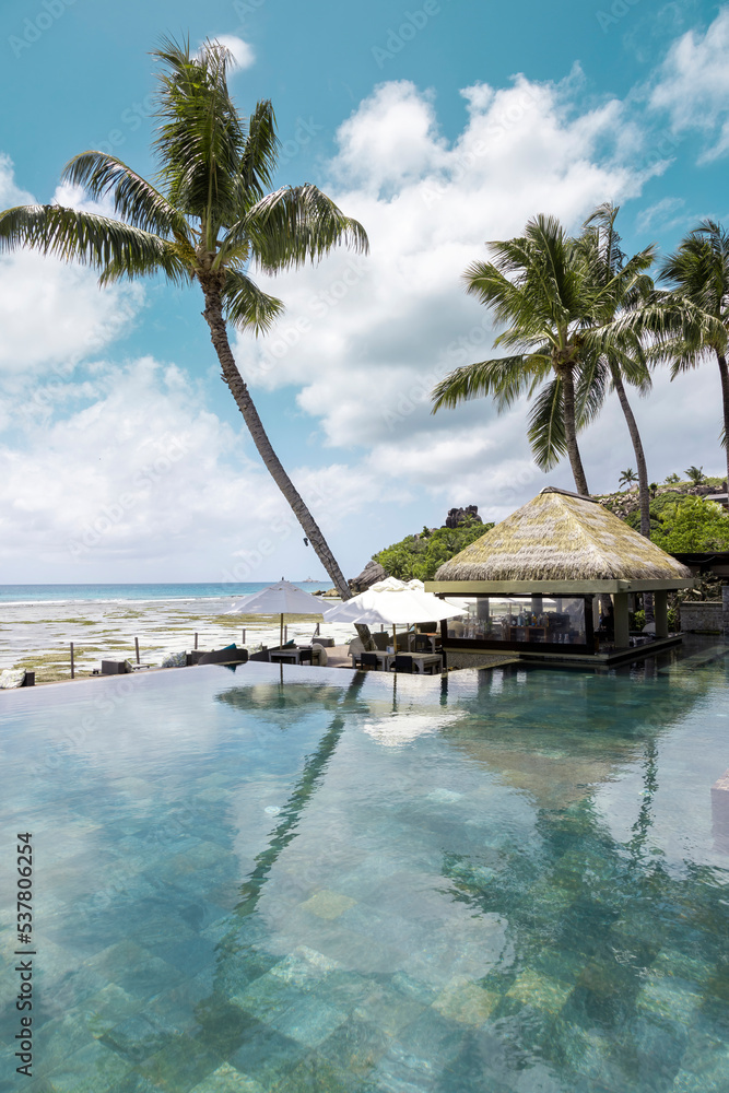 Luxury swimming pool in tropical infinity pool, relaxing holidays in Seychelles islands. La Digue Luxury swimming pool in tropical infinity pool, relaxing holidays in Seychelles islands. La Digue