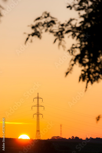 high voltage column in sunset