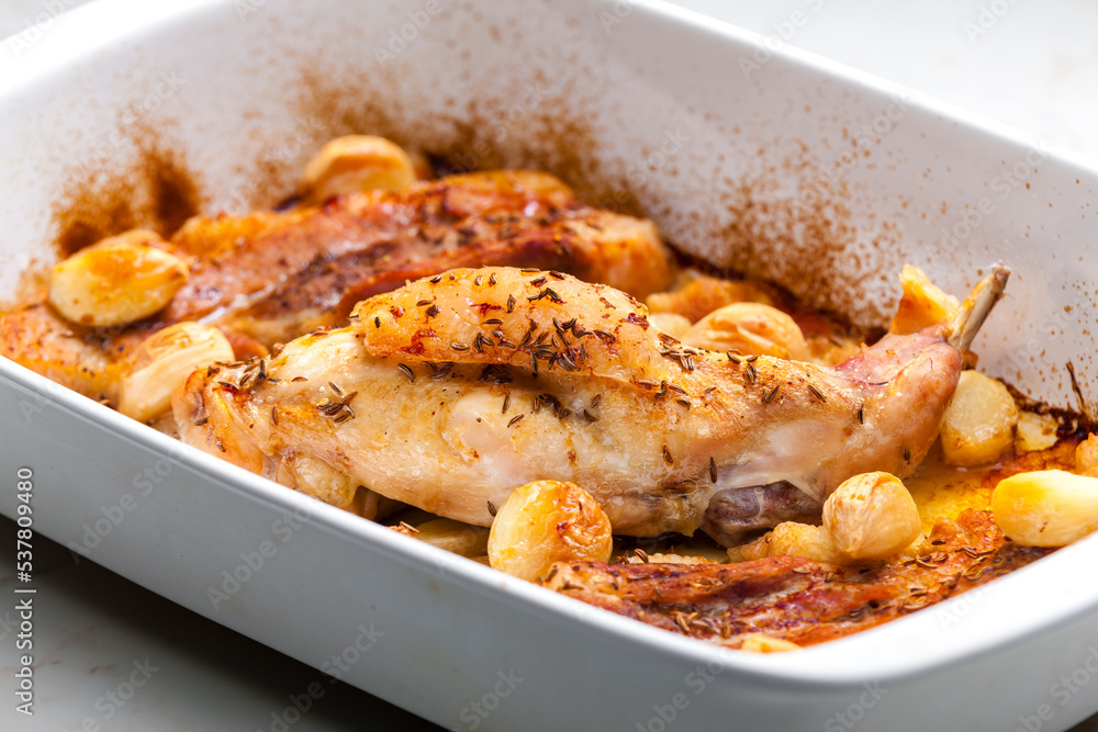 baked rabbit leg with garlic and bacon baked rabbit leg with garlic and bacon