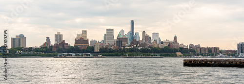 Panorama of Brooklyn skyscrapers across the East River on an overcast cloudy day