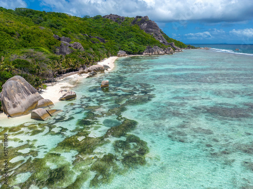 Drone view Anse Source d'Argent, La Digue Seychelles, tropical beach during a luxury vacation in Seychelles. Tropical beach Anse Source d'Argent, La Digue Seychelles