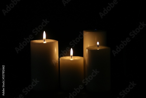 lighted candles on a black background