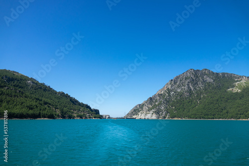 View of the lake and mountain cliffs in the area of the Oimapinar dam. Landscape of Green canyon, Manavgat, Antalya, Turkey © Goldream