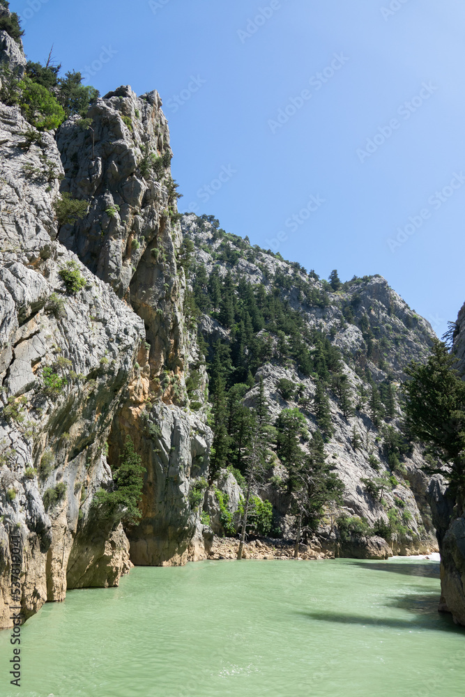 View of the lake with green water and on the mountain cliffs of the Green Canyon. Landscape of Green canyon, Manavgat, Antalya, Turkey
