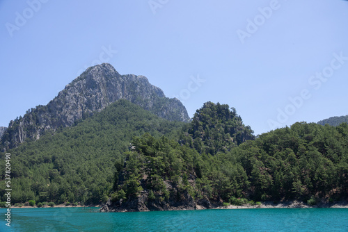 View of the lake with clear turquoise water and on the mountain cliffs of the Green Canyon. Landscape of Green canyon, Manavgat, Antalya, Turkey