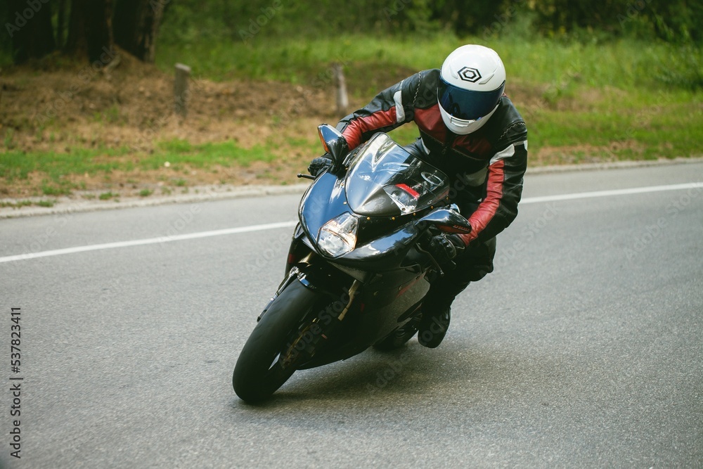 Sport Biker Racing on Road