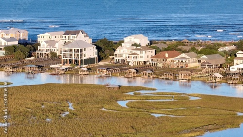 Coastline of Pawleys Island South Carolina a popular family vacation destination in the Grand Strand with beach houses and natural tidal marsh photo