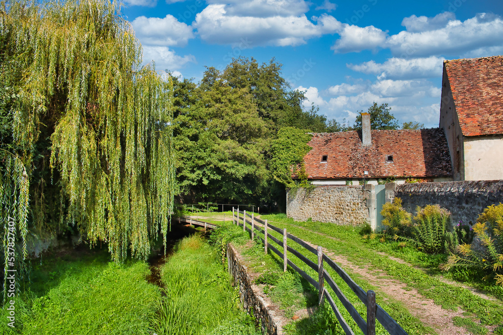 Small river and footpath along the city wall of the medieval town of Moulins-Engilbert, department of Nièvre, Morvan, France
Small river and footpath along the city wall of the medieval town of Moulins-Engilbert, department of Nièvre, Morvan, France