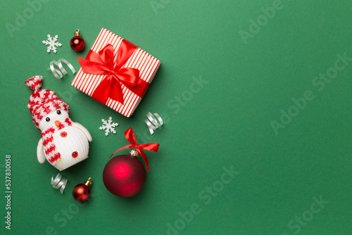 Christmas toys and decoration on color background, top view