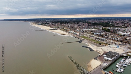 Aerial view of Lowestoft harbour and port with boats docked and far reaching views. Lowestoft England.  photo