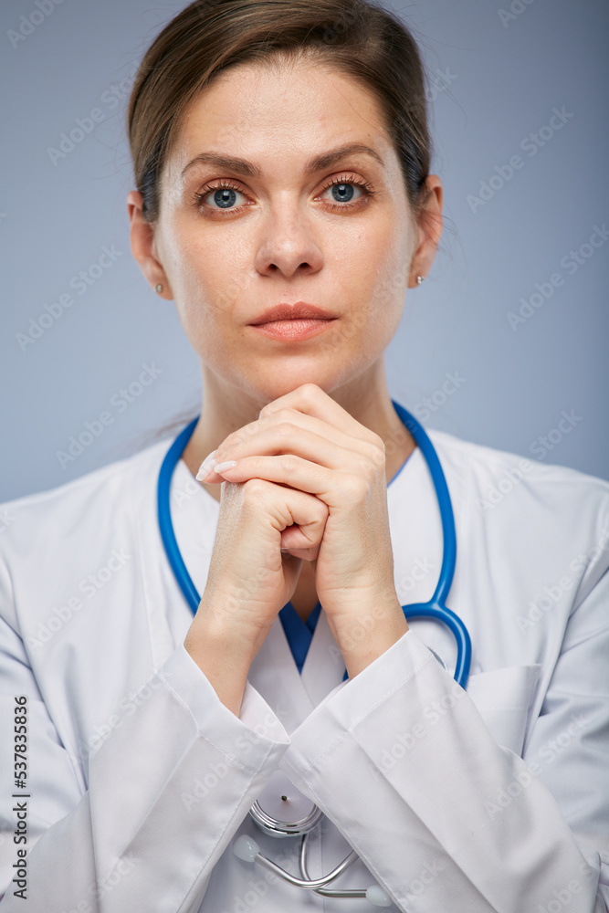 Serious doctor woman isolated close up face isolated portrait. Serious doctor woman isolated close up face isolated portrait.