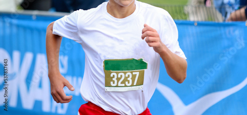 Runner finishing a cross country race © coachwood