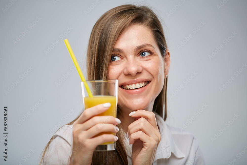 Happy woman with orange juice looking away. Isolated female advertising portrait. Happy woman with orange juice looking away. Isolated female advertising portrait.