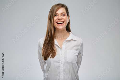 Portrait of happy smiling business woman in white shirt.