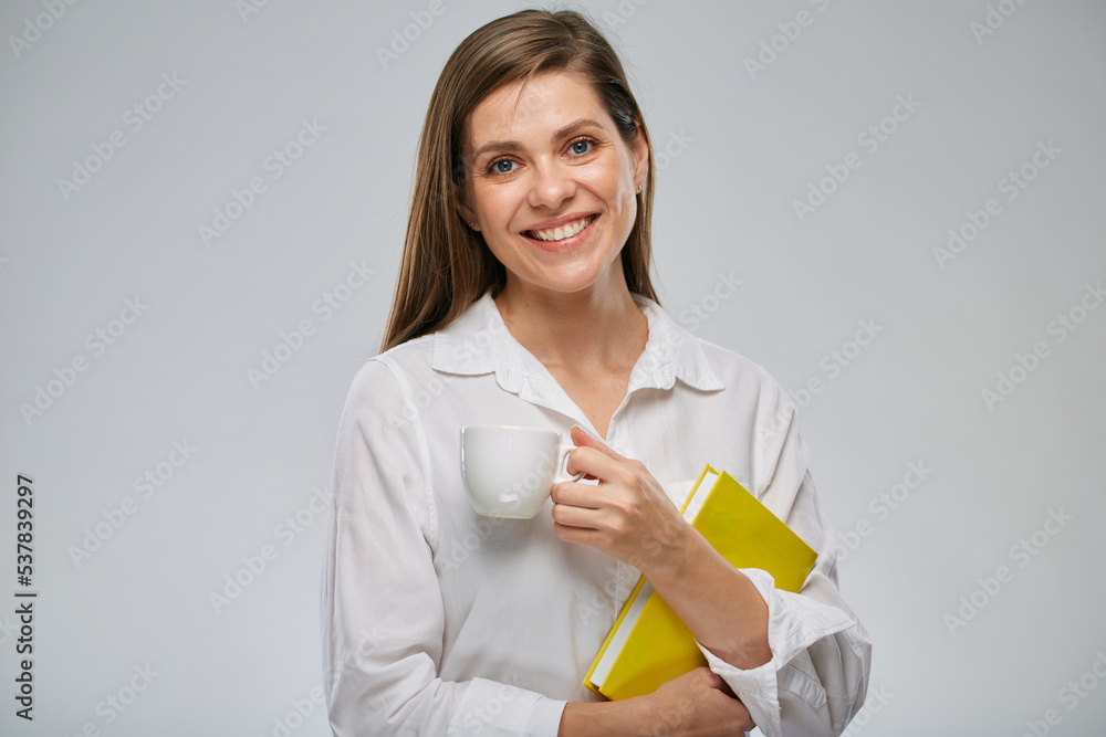 Woman holding book and white coffee cup. Isolated advertising portrait. Woman holding book and white coffee cup. Isolated advertising portrait.