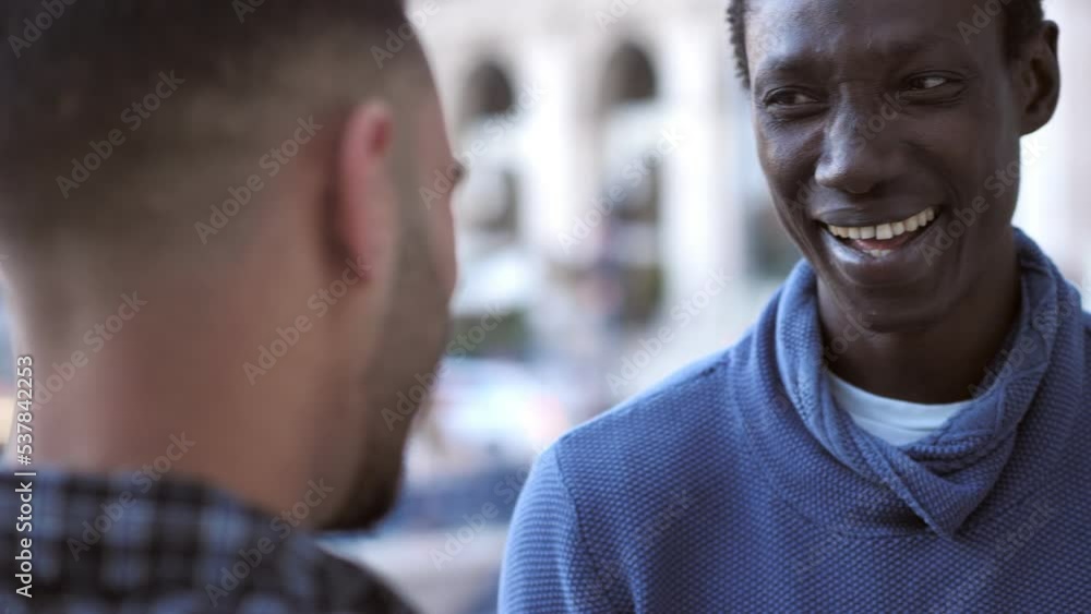Happy african man talking and laughing with a friend Happy african man talking and laughing with a friend