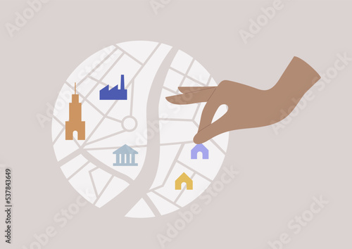 City planner, a hand putting residential houses, banks, industrial factories, and skyscrapers on the map, real estate business, construction work.