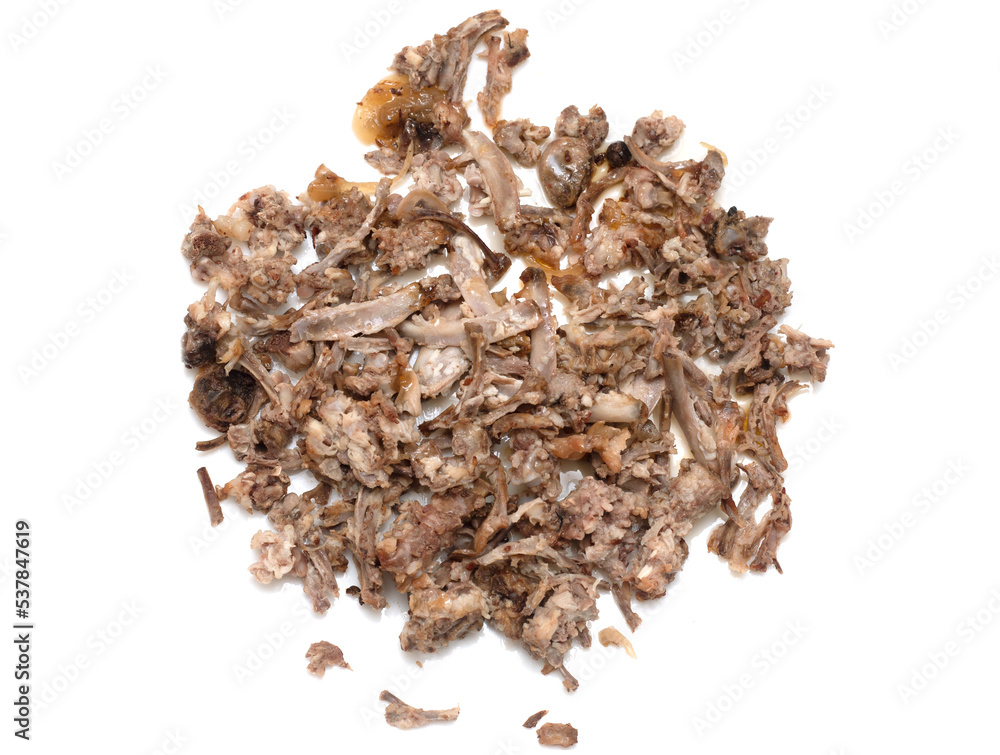 Chicken bones after eating on a white background. Chicken bones after eating on a white background.