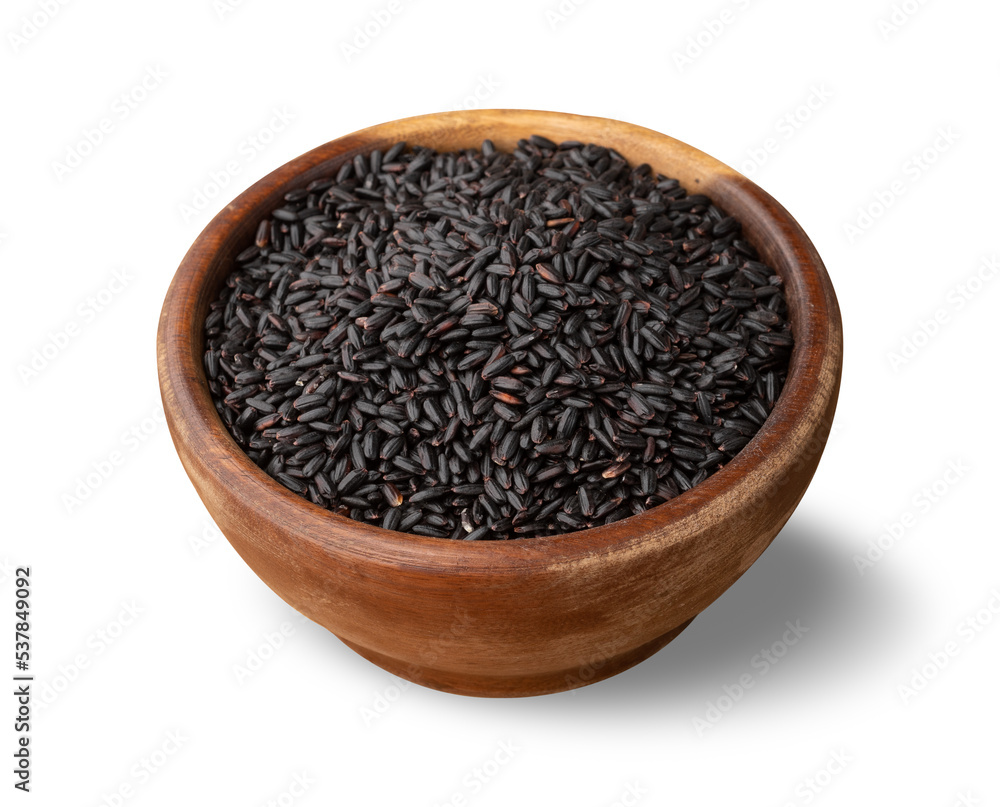 Raw black rice in a bowl isolated over white background Raw black rice in a bowl isolated over white background