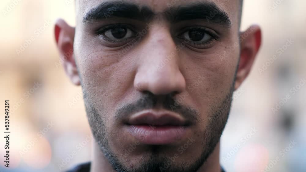 Portrait serious face tunisian man looking at camera in an urban atmosphere Portrait serious face tunisian man looking at camera in an urban atmosphere