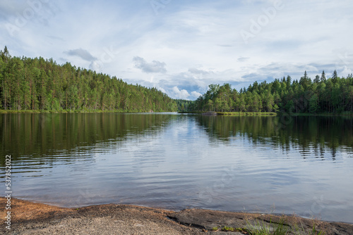 View to Valkjärvi lake from Sukeltajaniemi campfire place in the National park of Repovesi on clear summer evening