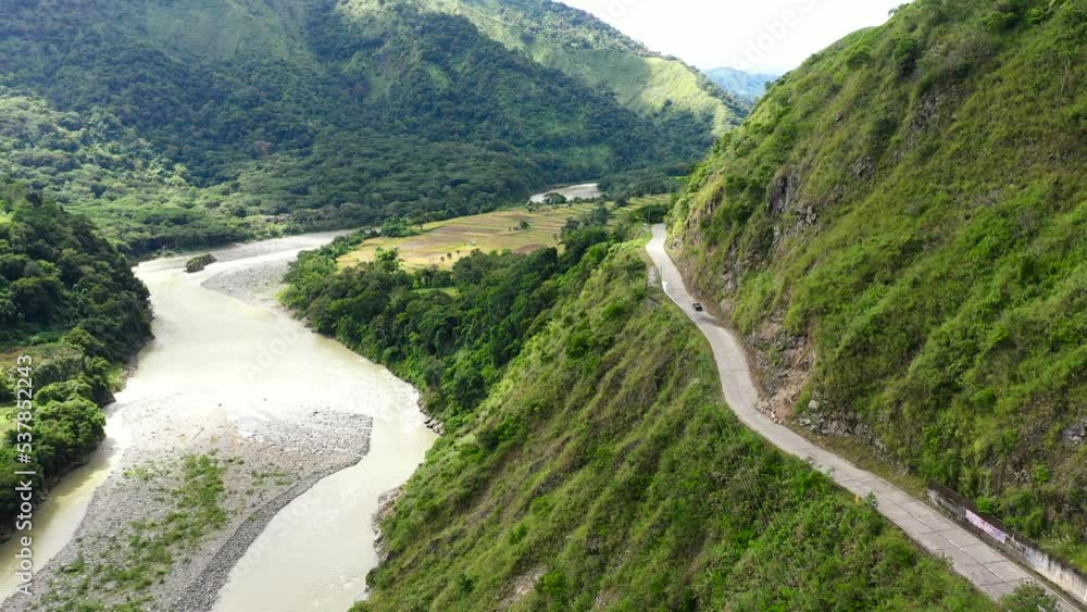 Mountain road on the island of Luzon, aerial view. Philippines mountain landscape. Winding rainforest road in Cordillera mountains. Travel concept and idea. Empty Road in Cordillera Mountains, Luzon