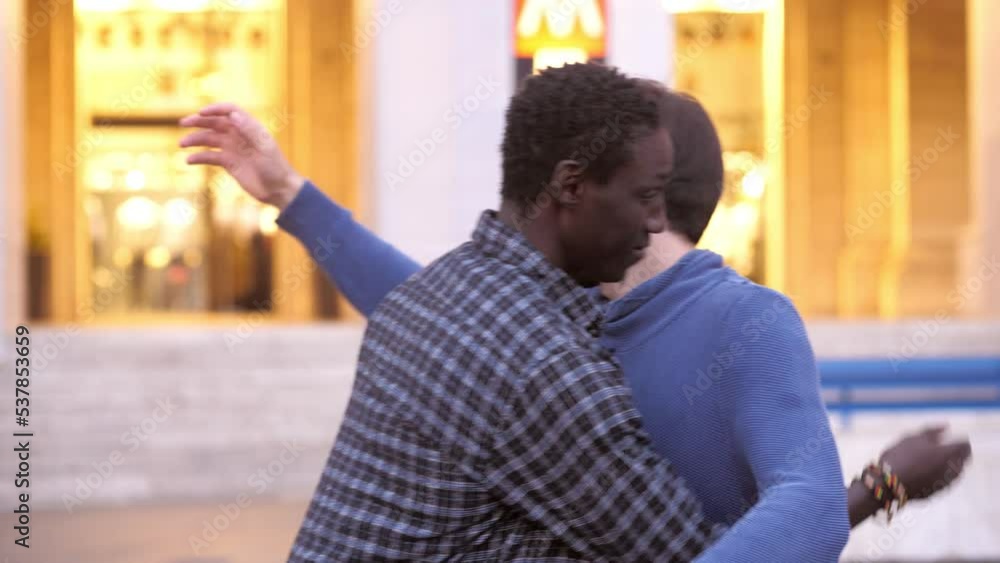 Stop racism: African American man and Caucasian man hug each other Stop racism: African American man and Caucasian man hug each other