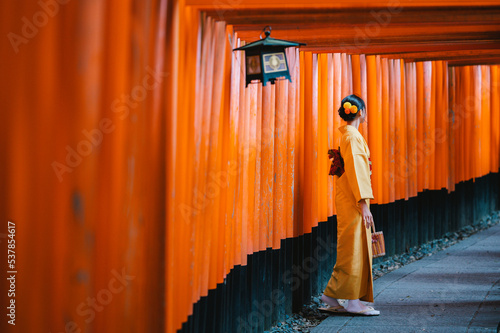 Japanese woman at Fushimi Inari Shrine, Kyoto, Japan
