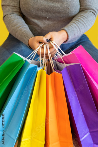 Shopping bags in the woman hands. Joy of consumption. Purchases, black friday, discounts, sale concept. .