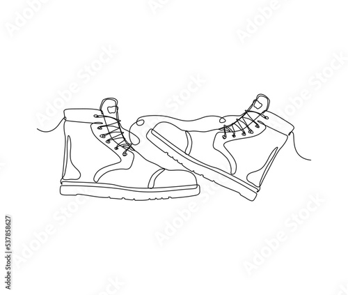 Continuous one line drawing of man work boots. Safety hiking boots line art drawing.