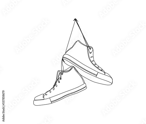 Continuous one line drawing of shoes hanging on the wall. Fashionable and casual sneakers line art drawing vector design.