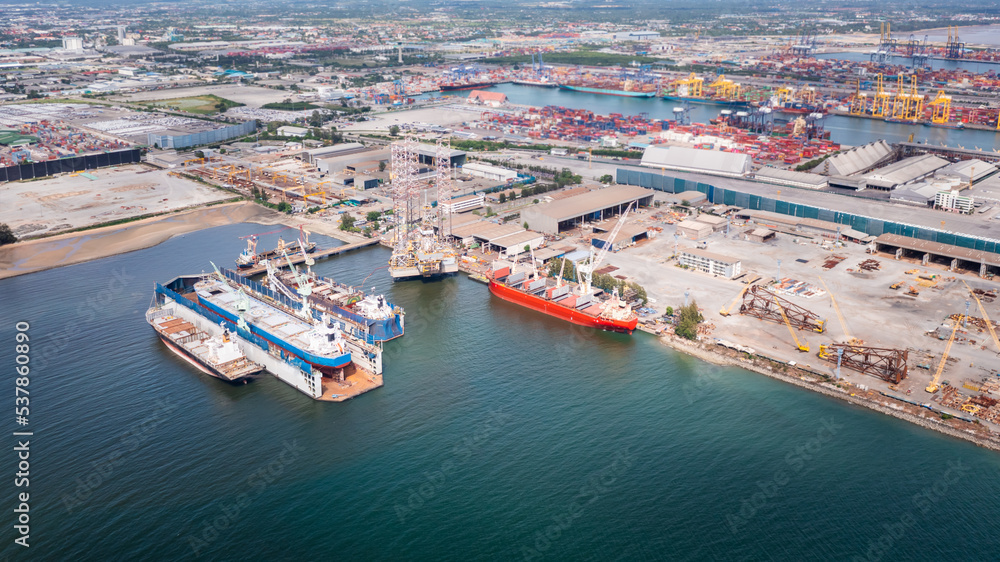 aerial view shipyard dry dock maintenance and repair container ship transport and oil ships in sea, business and industry service