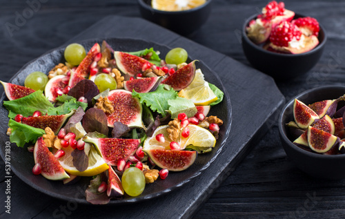 Fresh fruit salad with figs, grapes and pomegranates