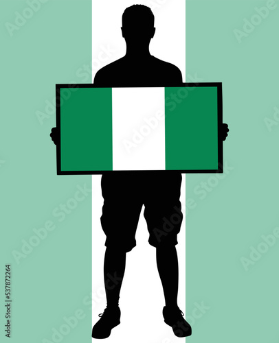 man holding a flag of Nigeria
