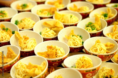 Bowl of noodles with crakers lined up