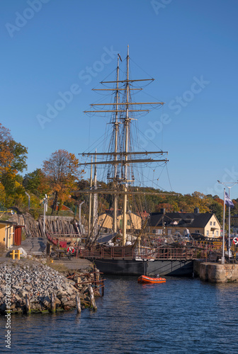 Old sailboat in a dry dock on the island Beckholmen wharf a sunny a color full autumn day in Stockholm