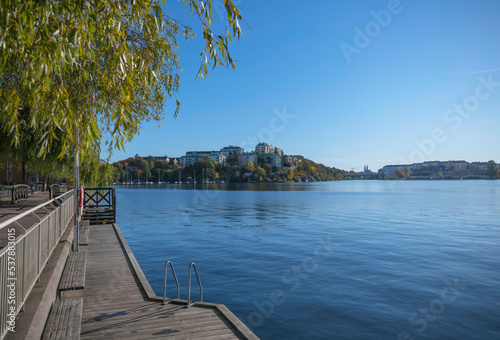 Photography Piers at the bay Alviks Strand, boat club apartment and office building a sunny