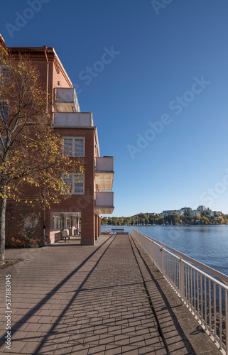 Pier view from the district Alviks Strand with apartment houses a sunny a color full autumn day in Stockholm