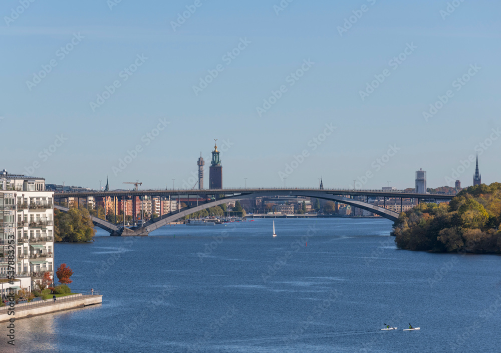 Panorama view, island Essingen, Lux district on the island Lilla Essingen, office, skyscrapers, bridge Västerbron to the district Södemalm at a bay in the lake Mälaren a sunny a color full autumn day 