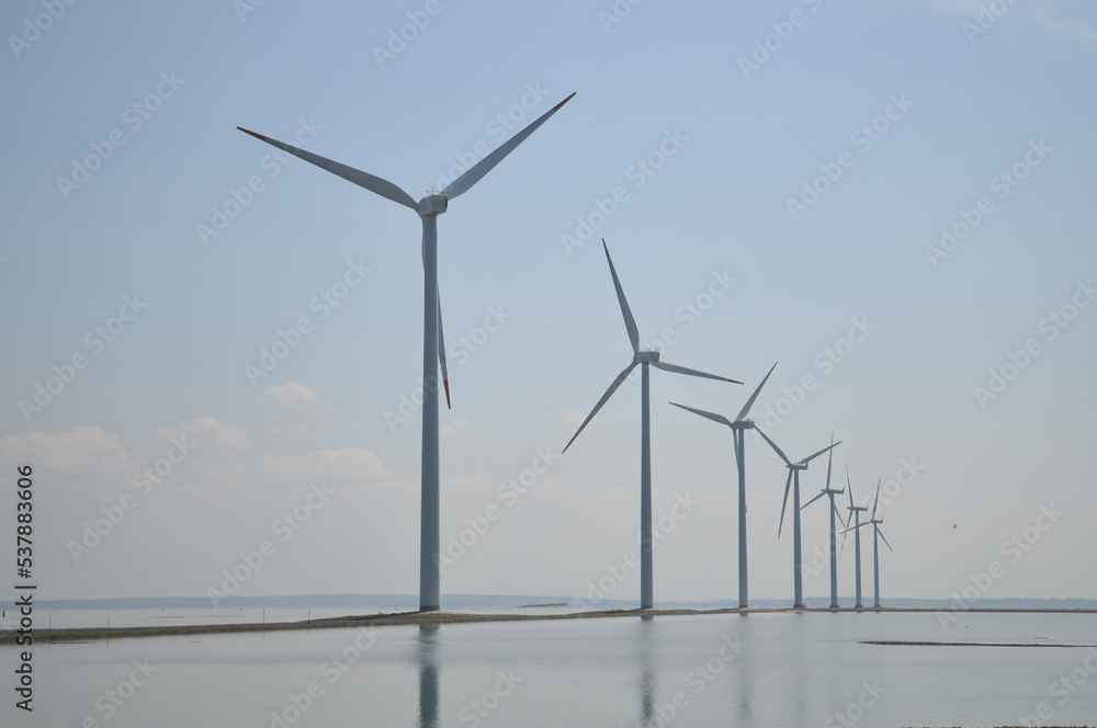 Fototapeta premium Wind farm windmills on the sea in Denmark