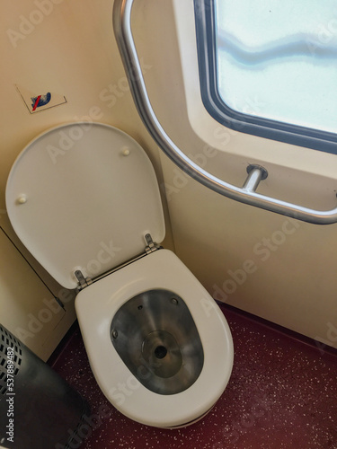 Shot of a toilet with a view of outside window on a high speed train in europe