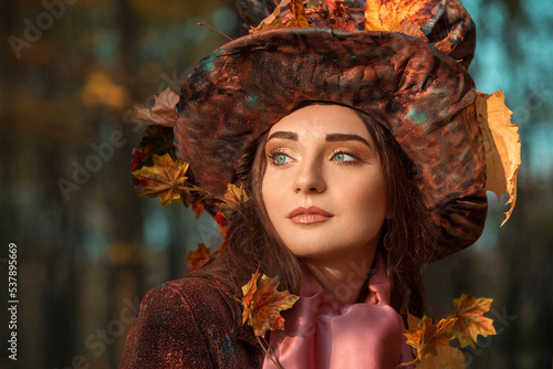 Beautiful young woman in victorian hat