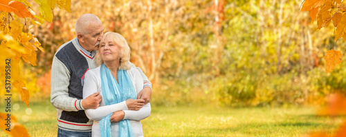 Elderly mature couple smiling and hugging