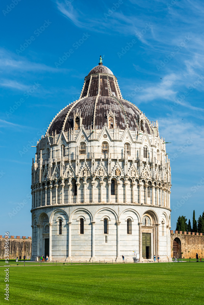 Medieval baptistery standing in miracles square in Pisa