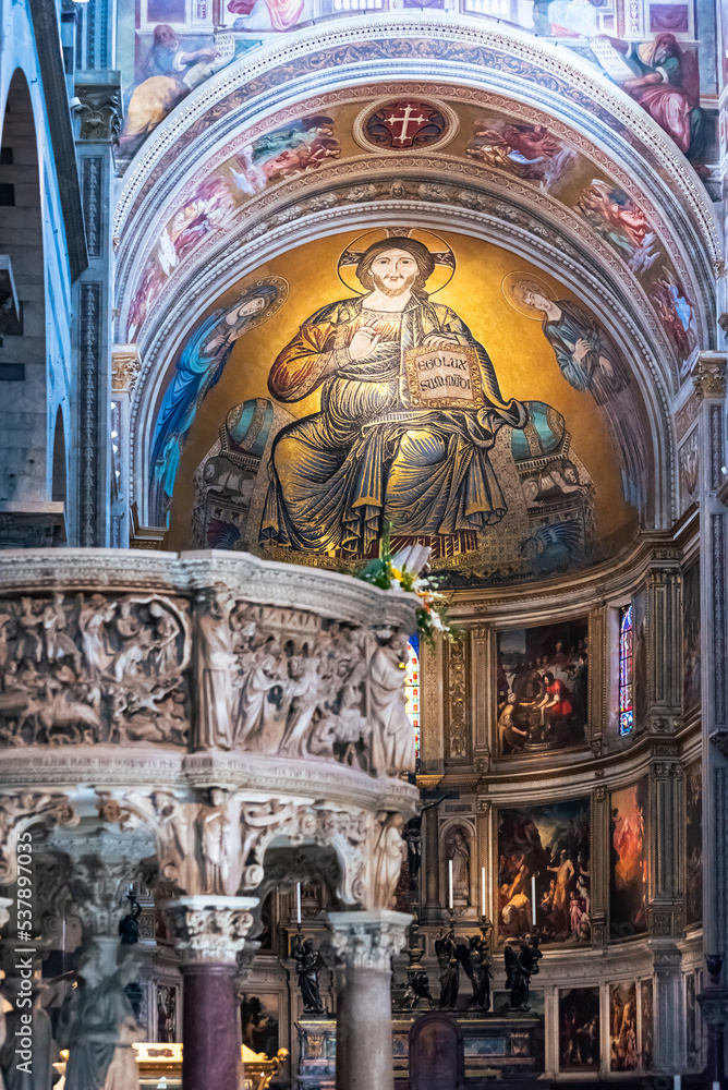 Beautiful golden fresco decorating interior of catholic basilica in Pisa